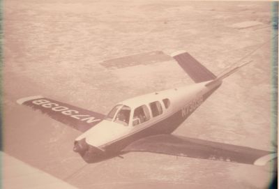 b N7303B in formation circa 1965